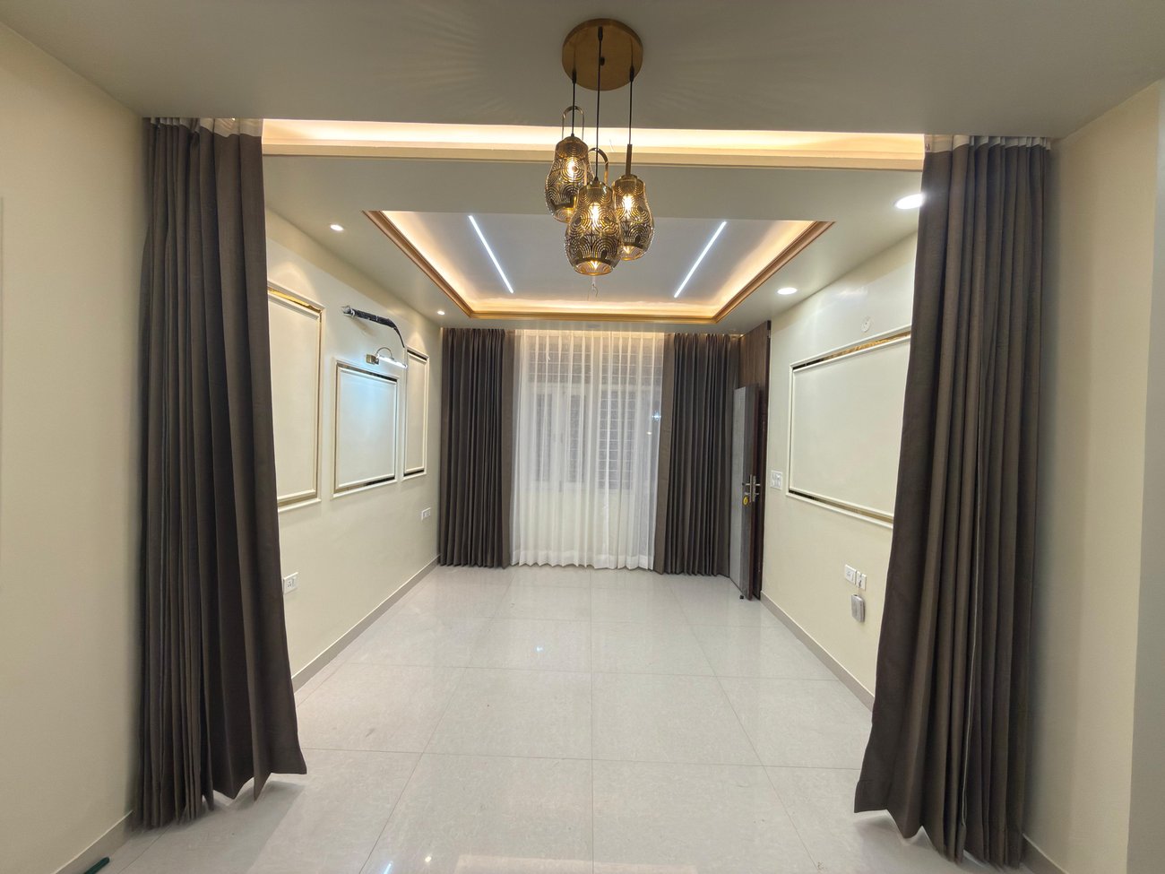 Dark curtains in an open-plan dining and living space