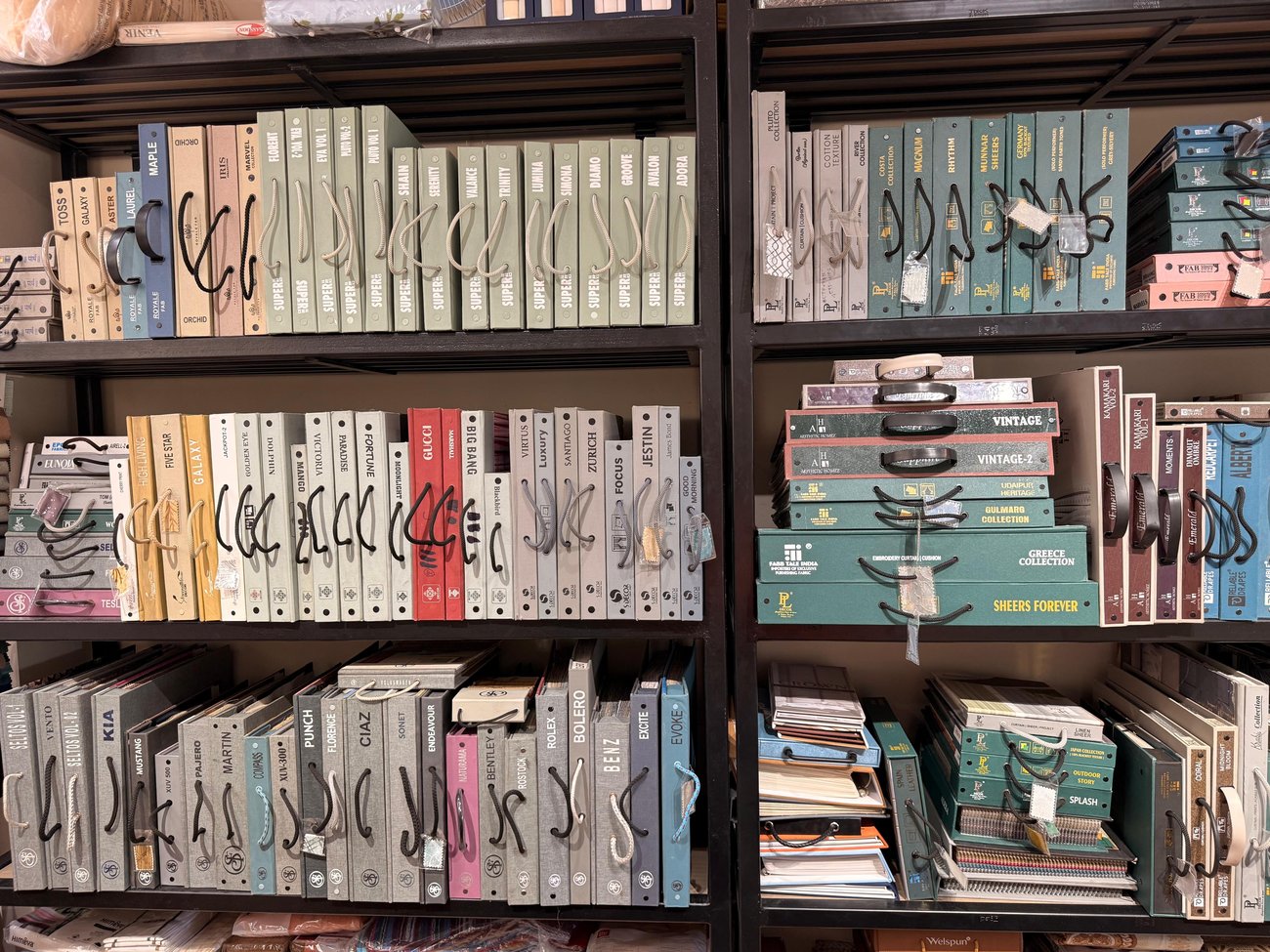 Curtain fabric sample books at OM Furnishing showroom
