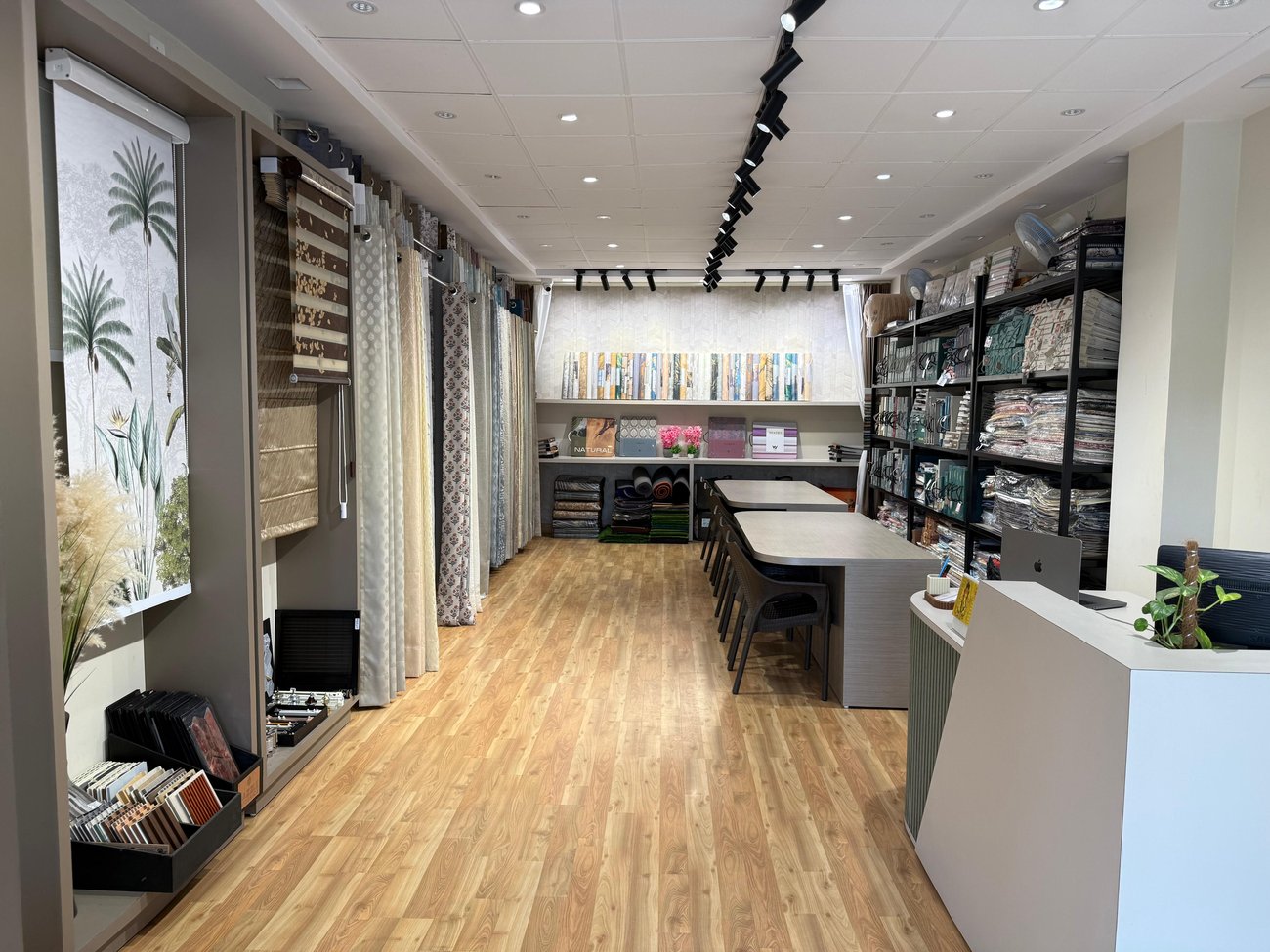 OM Furnishing showroom interior with curtains, wallpapers and fabric displays