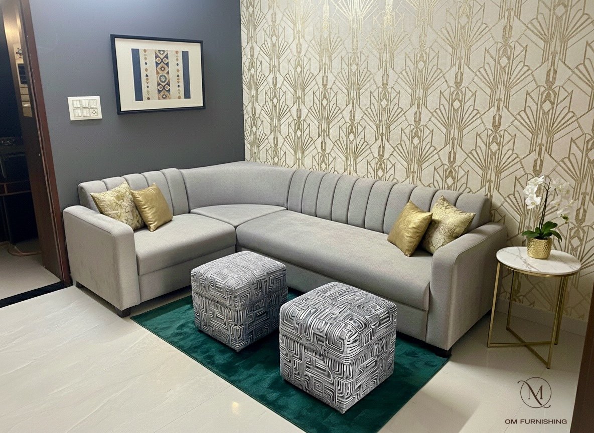 Gold botanical wallpaper feature wall behind a grey sofa